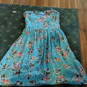 A tropical strapless dress with a floral pattern